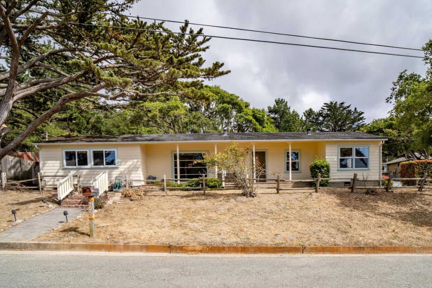 305 Stuart Avenue Pacific Grove, CA 93950 - Photo 4 of 24 a view of a house with a patio
