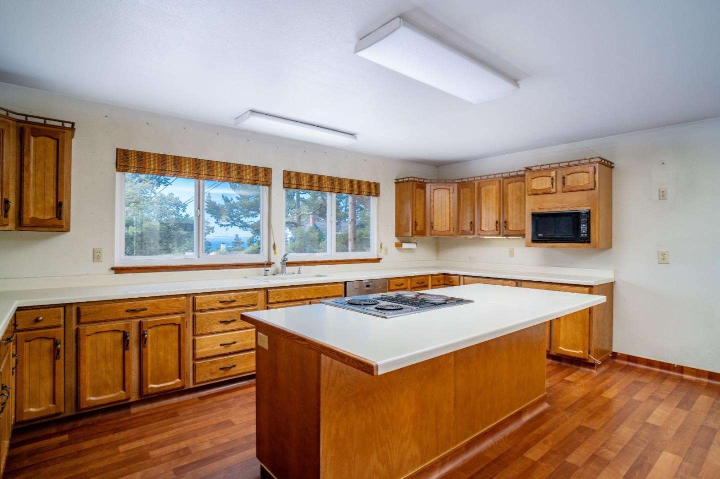 305 Stuart Avenue Pacific Grove, CA 93950 - Photo 7 of 24 a kitchen that has a stove and a microwave