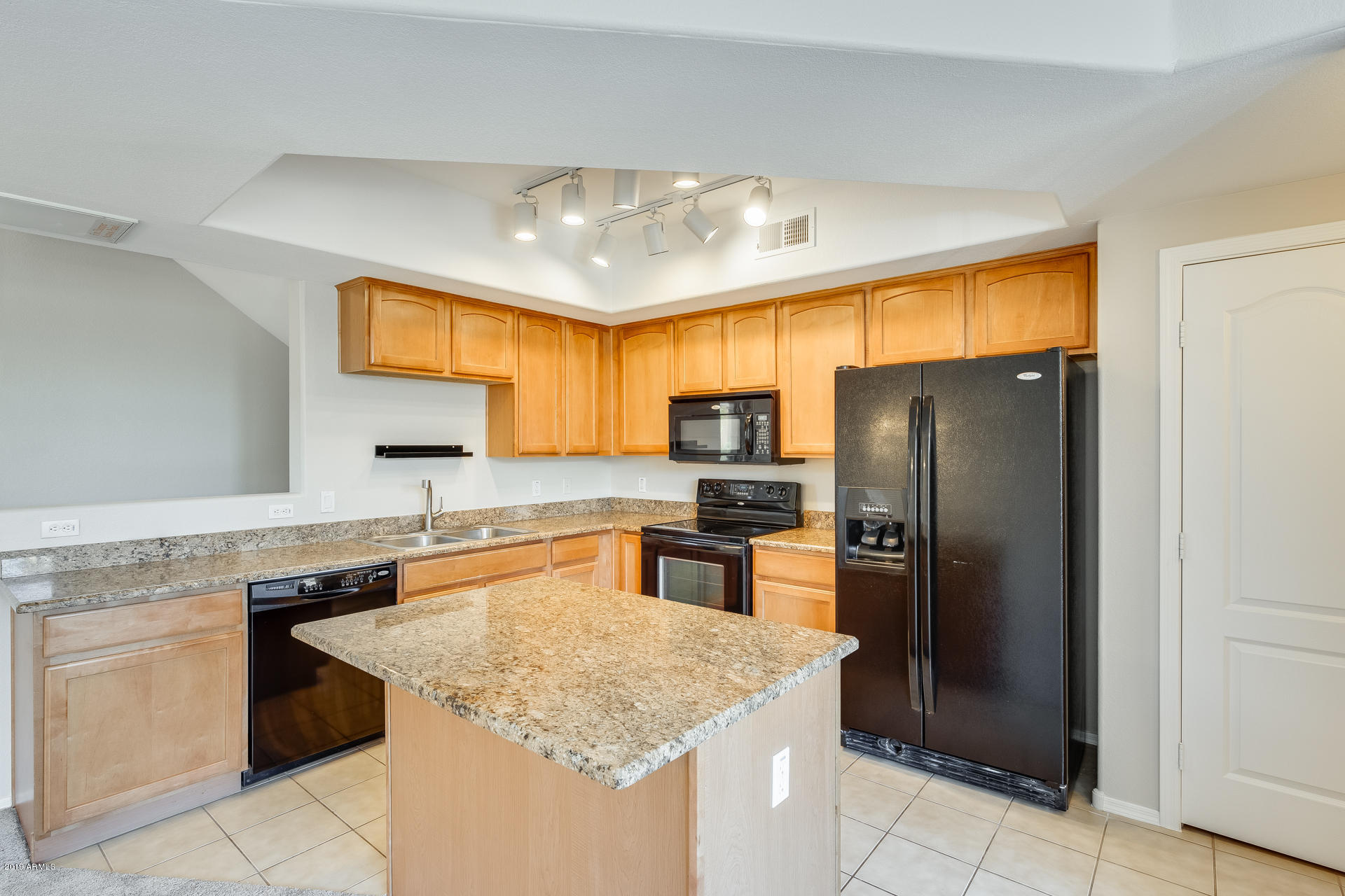 2401 East Rio Salado Parkway, Unit 1124 Tempe, AZ 85288 - Photo 11 of 32 a kitchen with stainless steel appliances granite countertop a refrigerator a sink a stove a microwave and island