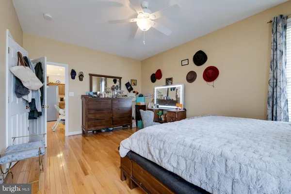 a bedroom with furniture and a chandelier