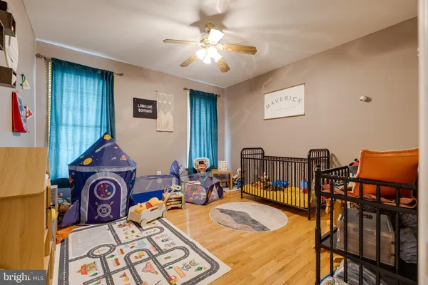 a view of a livingroom with furniture and a flat screen tv