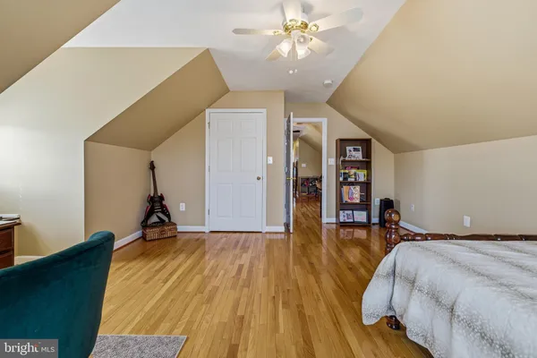 a bathroom with a sink a toilet and shower curtain