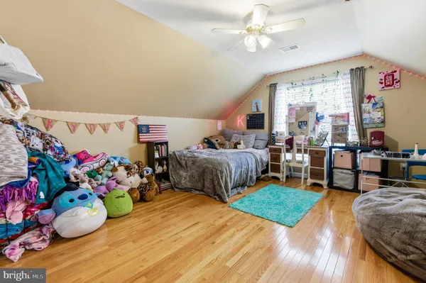 a bathroom with a sink a toilet and shower curtain