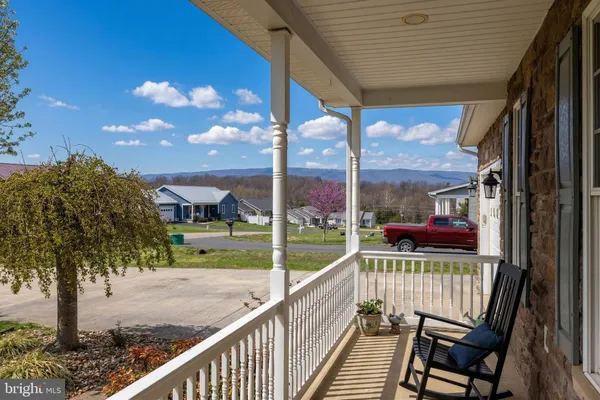 a view of a house with a small yard