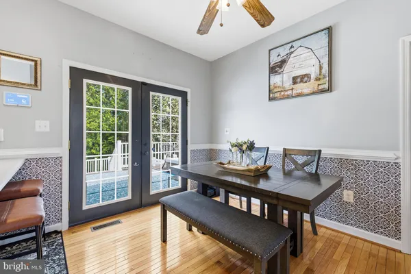 a view of a dining room with furniture window and outside view
