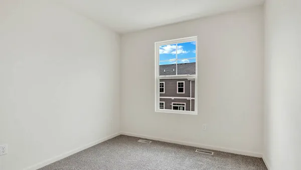 a view of an empty room with windows