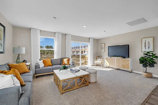 a living room with furniture and a flat screen tv