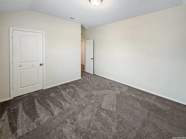 a bathroom with double vanity sinks and a large mirror