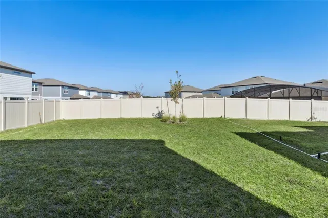 a view of a back yard of the house