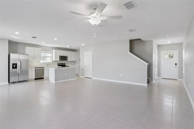 a view of a kitchen with a sink and a stove top oven