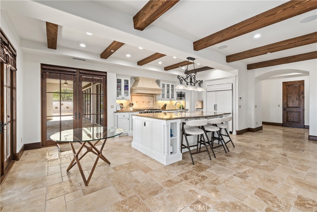 22 Sky Ranch Road Ladera Ranch, CA 92694 - Photo 14 of 54 a view of a kitchen and dining area