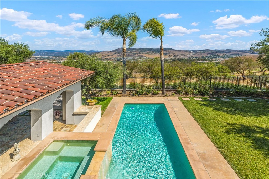 22 Sky Ranch Road Ladera Ranch, CA 92694 - Photo 39 of 54 a view of a swimming pool with a garden