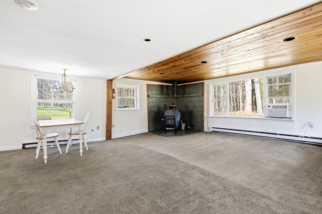 133 Lakeview Road Shutesbury, MA 01072 - Photo 3 of 24 a view of a livingroom with furniture and a window