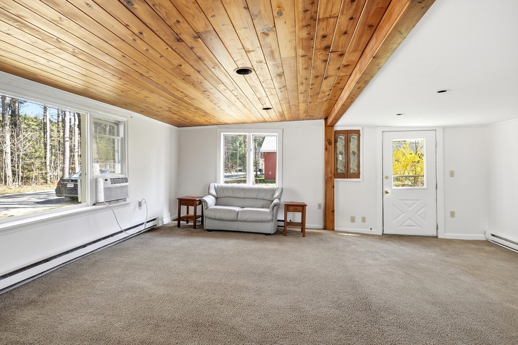 133 Lakeview Road Shutesbury, MA 01072 - Photo 4 of 24 a view of livingroom with furniture and windows