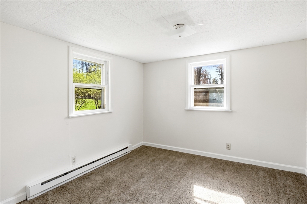 133 Lakeview Road Shutesbury, MA 01072 - Photo 9 of 24 an empty room with a window