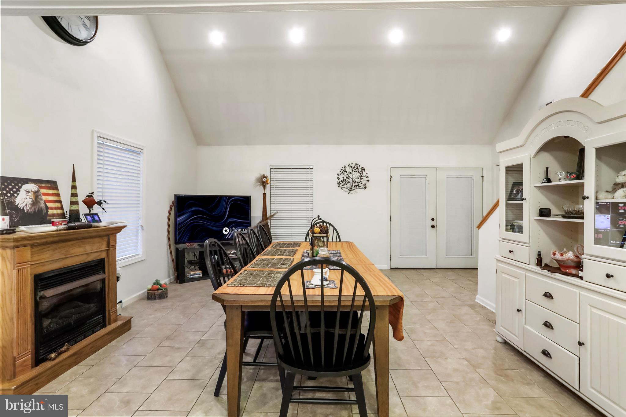 12542 Turkey Farm Road Northeast Little Orleans, MD 21766 - Photo 12 of 77 a dining room with furniture and a fireplace