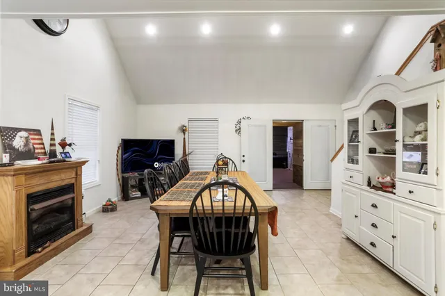 a view of a livingroom with hardwood and furniture