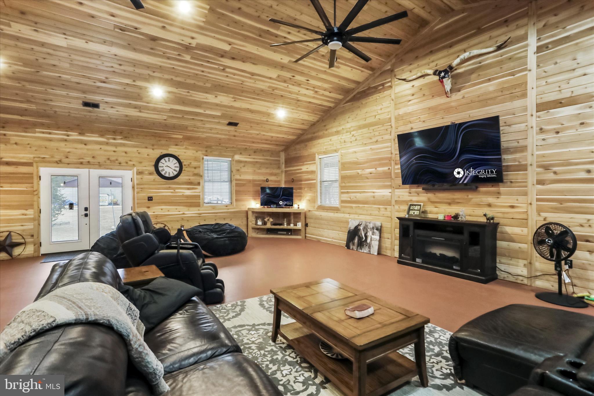 12542 Turkey Farm Road Northeast Little Orleans, MD 21766 - Photo 16 of 77 a living room with furniture and a flat screen tv