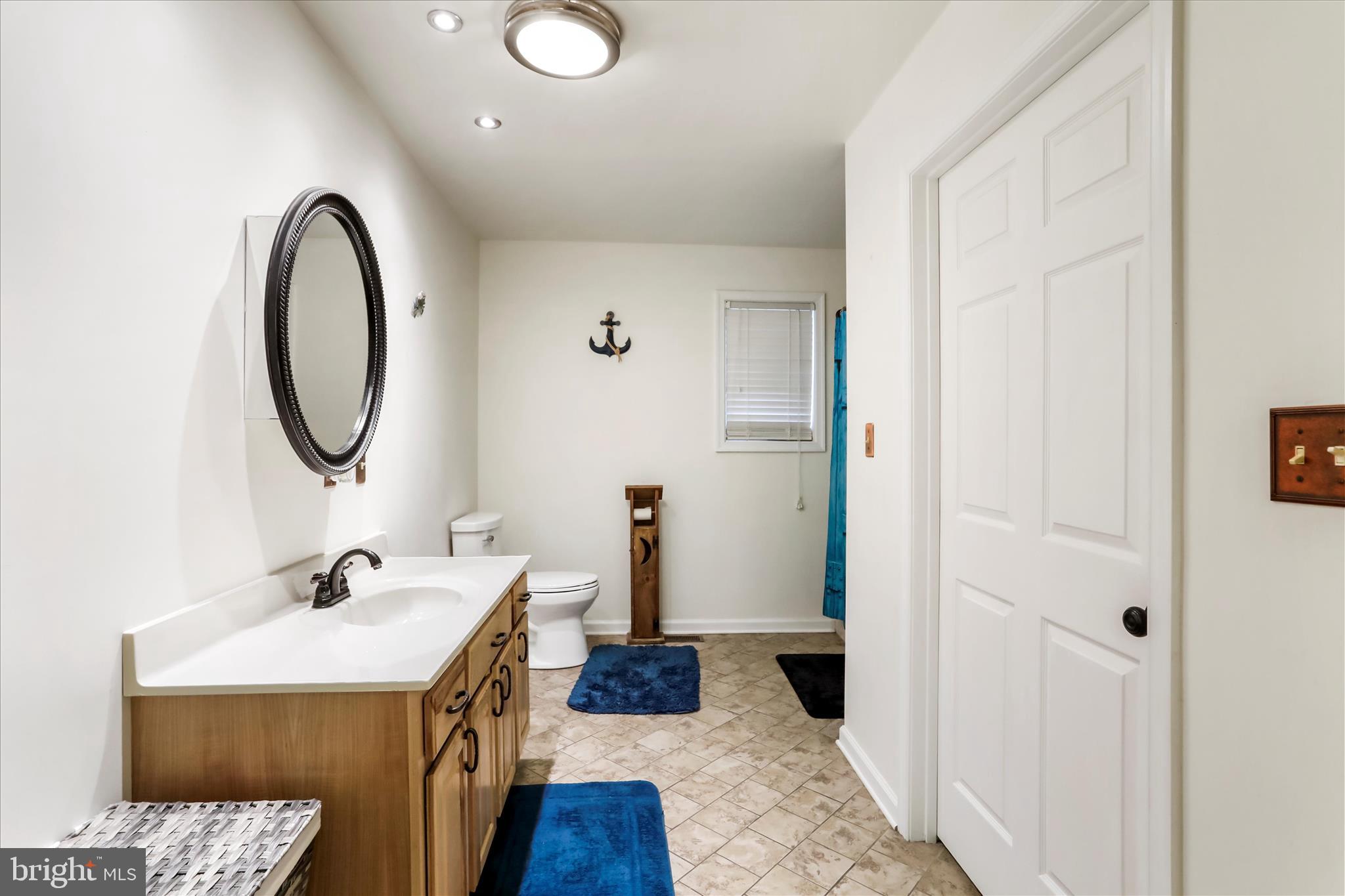 12542 Turkey Farm Road Northeast Little Orleans, MD 21766 - Photo 25 of 77 a bathroom with a sink and a mirror