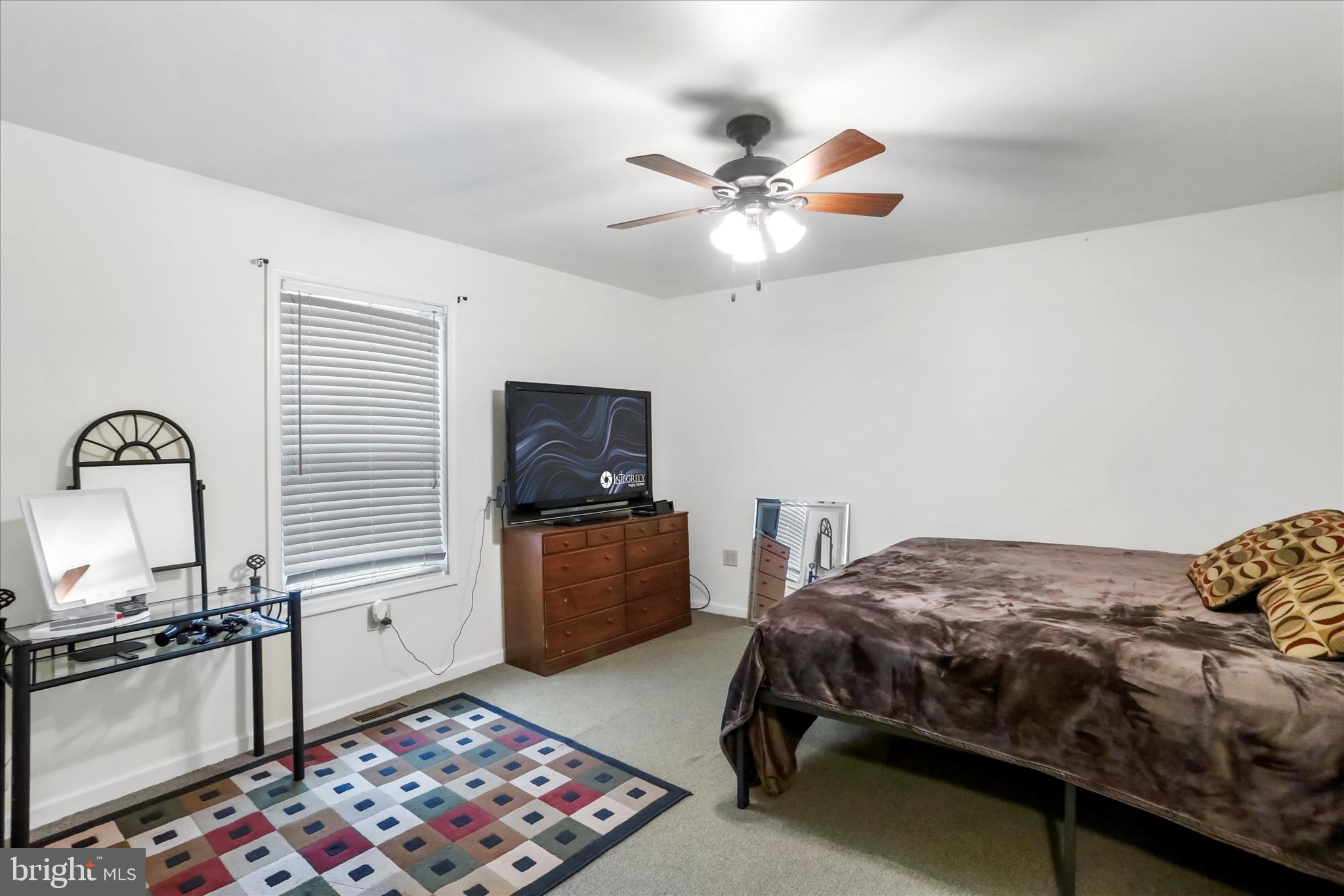12542 Turkey Farm Road Northeast Little Orleans, MD 21766 - Photo 26 of 77 a bedroom with a bed and a television
