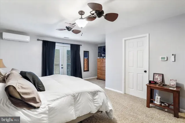 a couple of table and chairs in front of house
