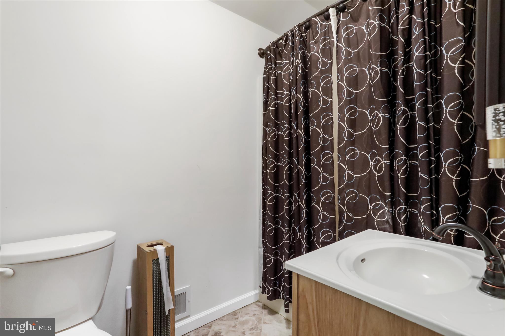12542 Turkey Farm Road Northeast Little Orleans, MD 21766 - Photo 32 of 77 a bathroom with a bathtub and sink