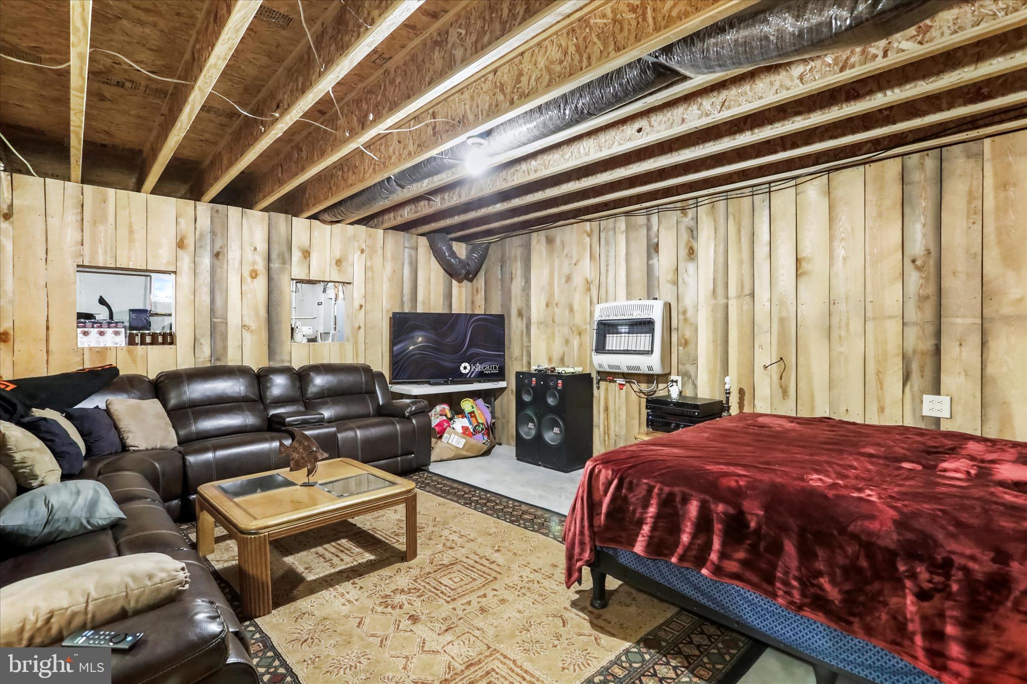 12542 Turkey Farm Road Northeast Little Orleans, MD 21766 - Photo 33 of 77 a bedroom with a bed a couch and dresser