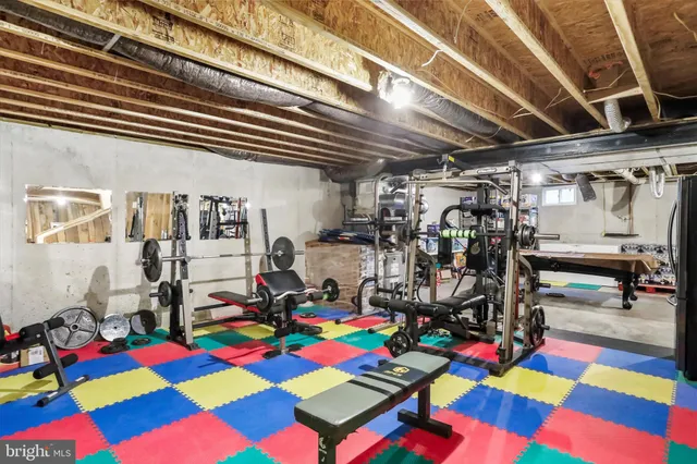 a view of backyard with table and chairs and potted plants