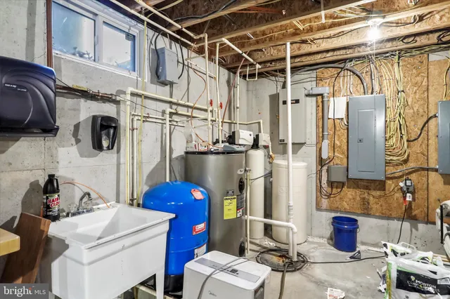 a view of a house with a yard and wooden fence