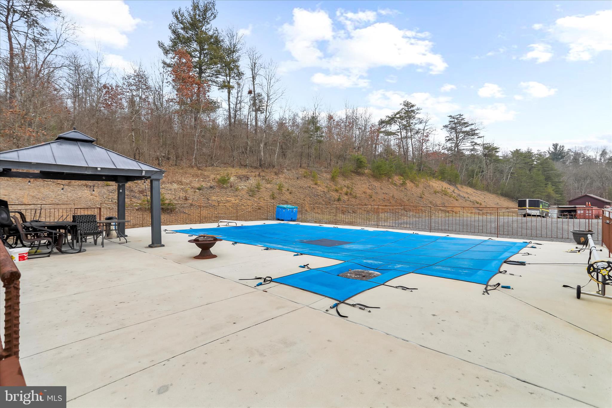 12542 Turkey Farm Road Northeast Little Orleans, MD 21766 - Photo 39 of 77 a view of swimming pool with a patio and wooden fence