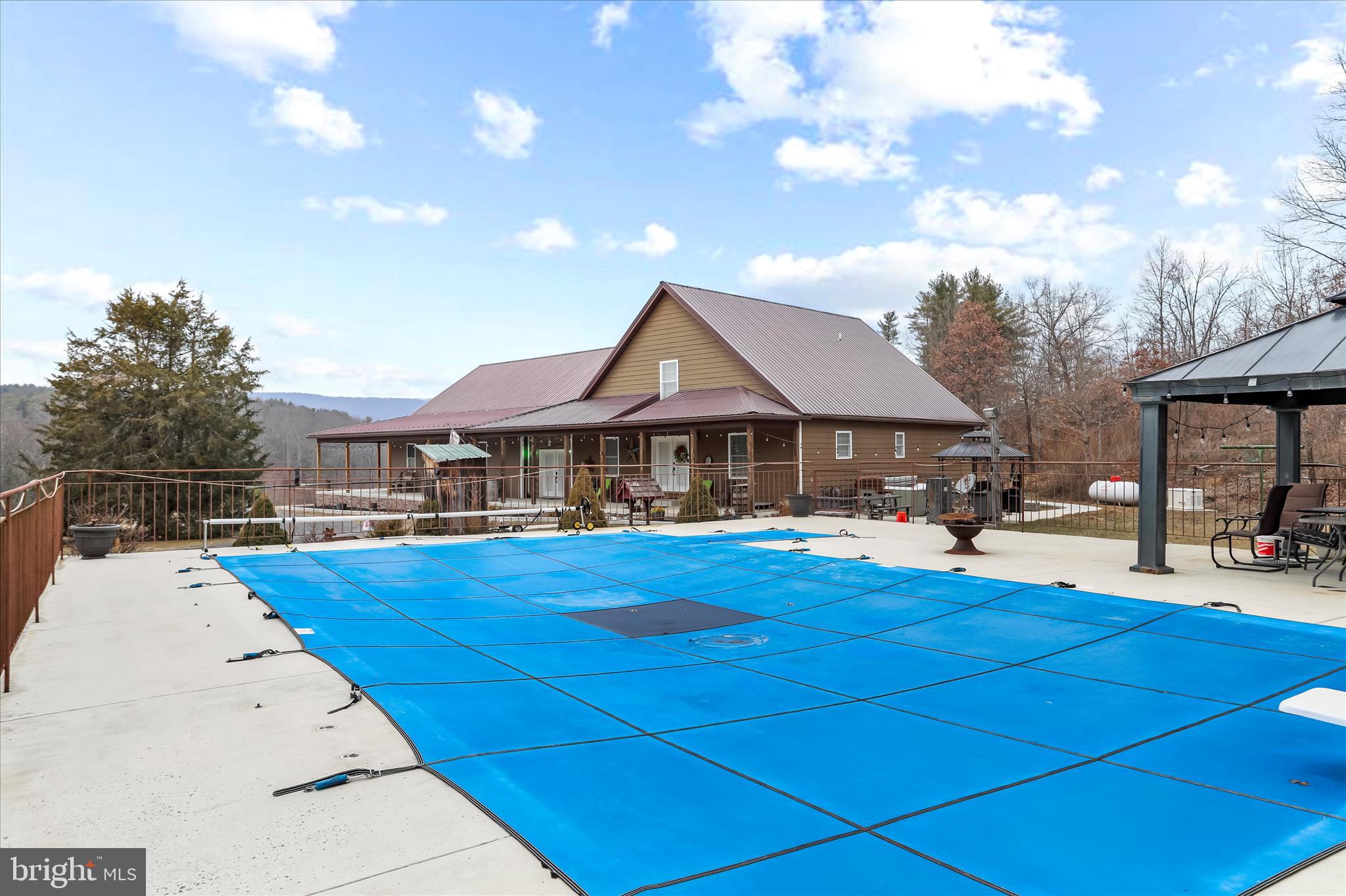 12542 Turkey Farm Road Northeast Little Orleans, MD 21766 - Photo 40 of 77 a view of a house with pool and sitting area