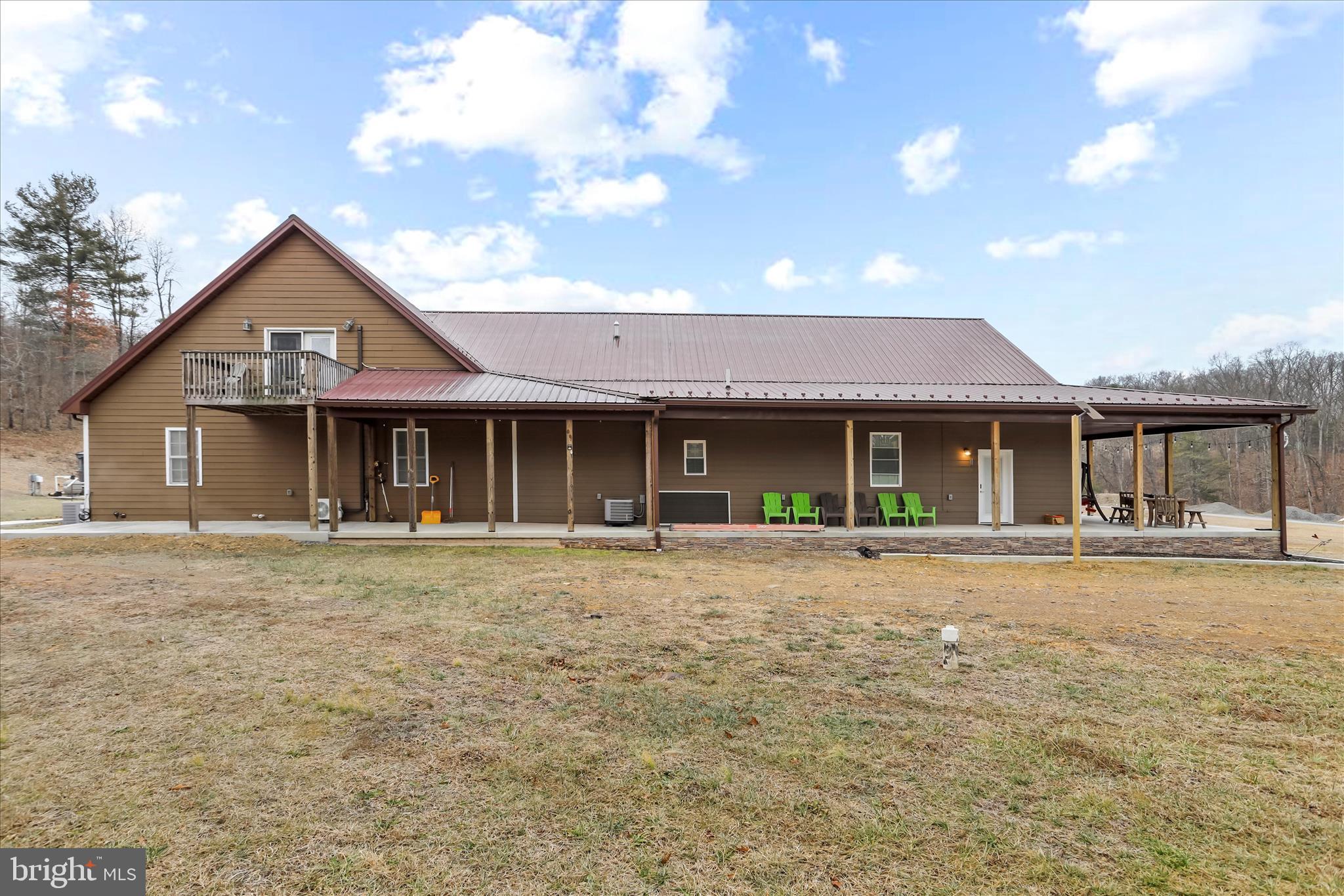 12542 Turkey Farm Road Northeast Little Orleans, MD 21766 - Photo 42 of 77 a front view of a house with a yard and garage