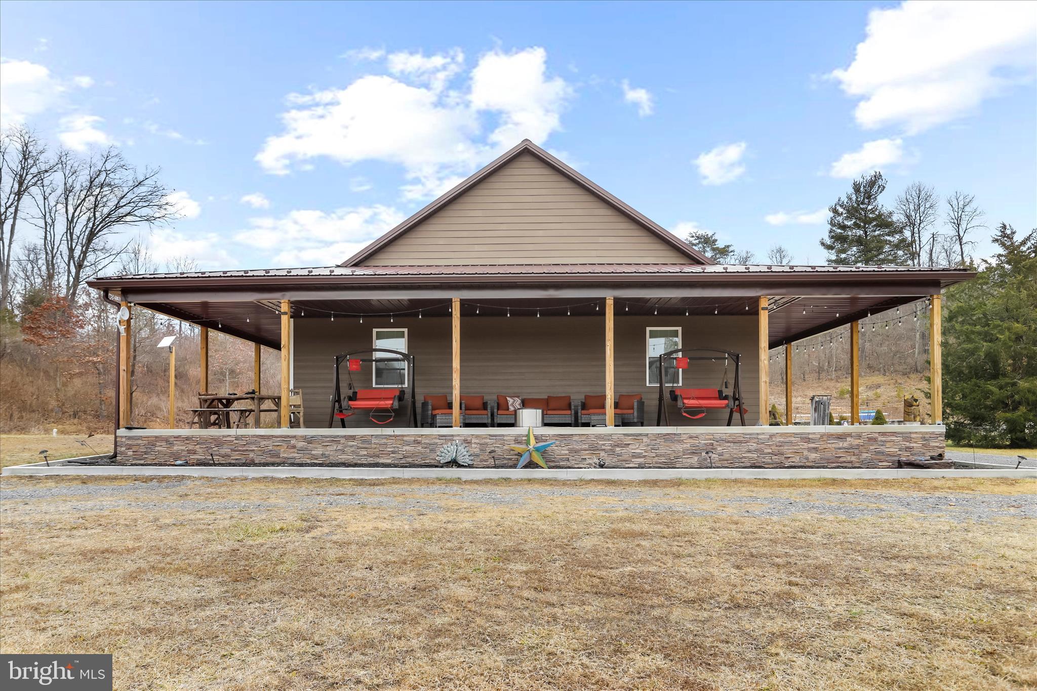 12542 Turkey Farm Road Northeast Little Orleans, MD 21766 - Photo 43 of 77 a view of a house with entrance stairs and a garden