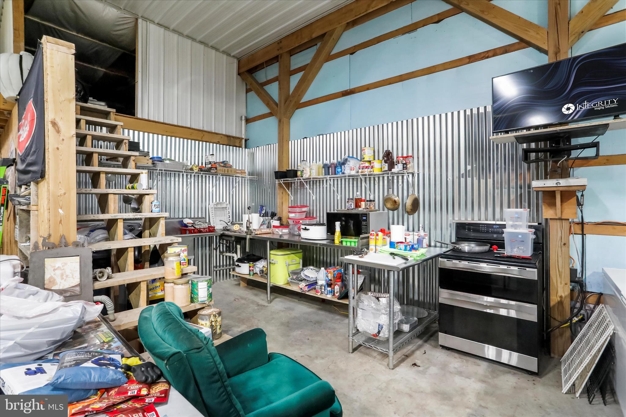 12542 Turkey Farm Road Northeast Little Orleans, MD 21766 - Photo 50 of 77 a room with lots of furniture and a flat screen tv