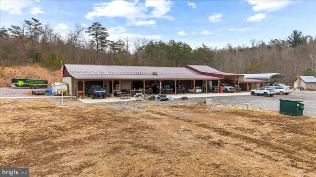 a kitchen with stainless steel appliances granite countertop a refrigerator a stove and a sink