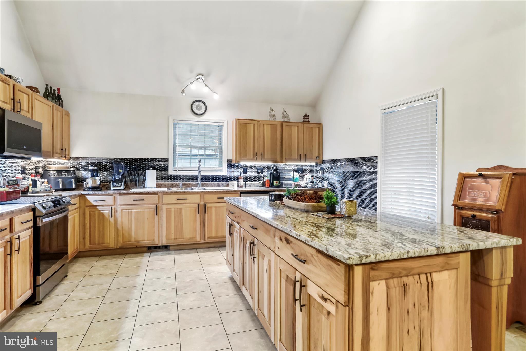 12542 Turkey Farm Road Northeast Little Orleans, MD 21766 - Photo 8 of 77 a kitchen with a sink stove and cabinets