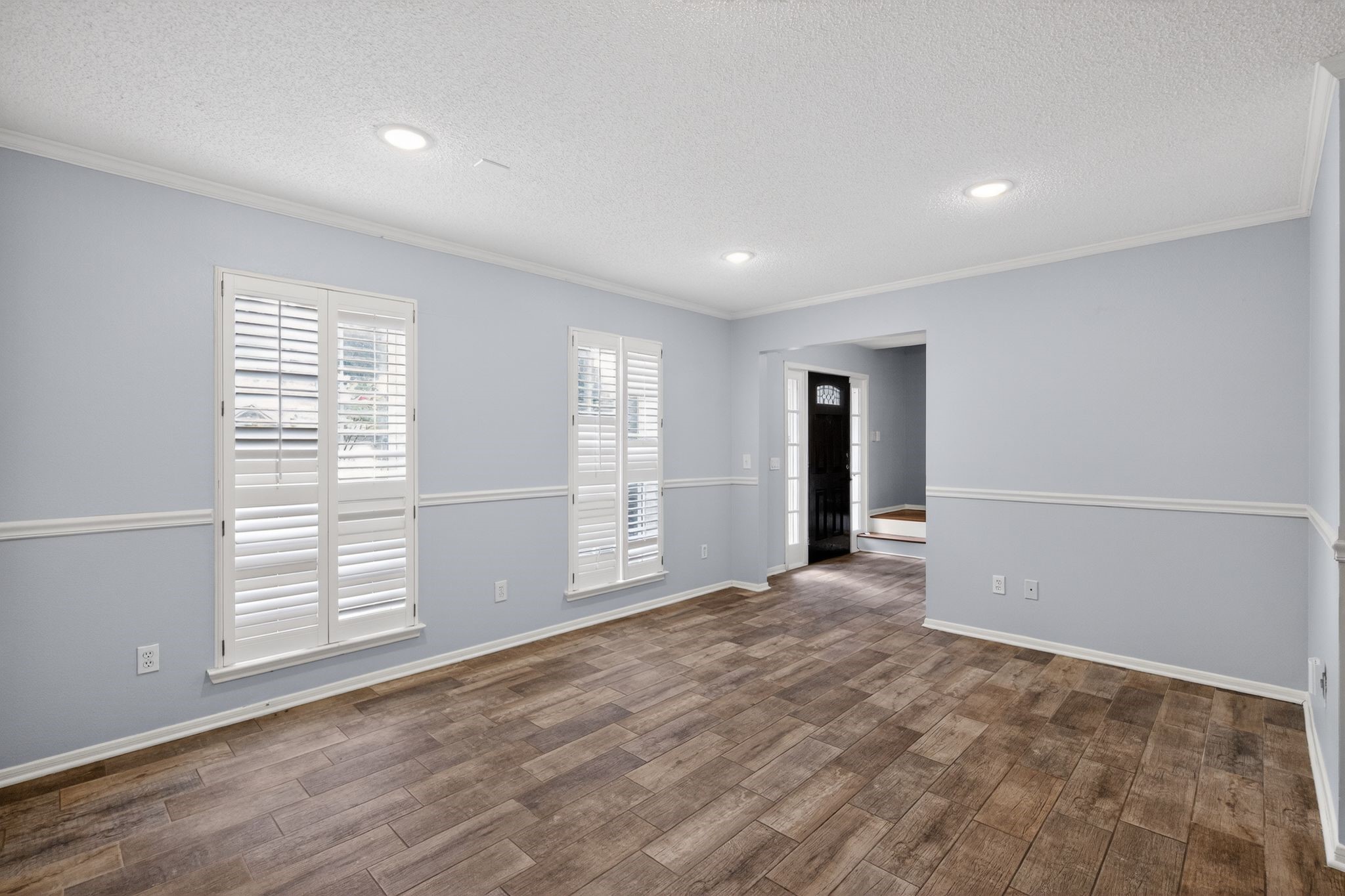 918 Long Prairie Drive Katy, TX 77450 - Photo 15 of 30 a view of empty room with wooden floor and fan