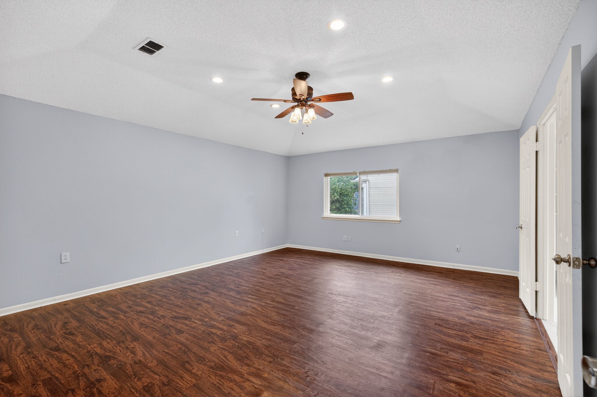 918 Long Prairie Drive Katy, TX 77450 - Photo 17 of 30 wooden floor in an empty room with a window