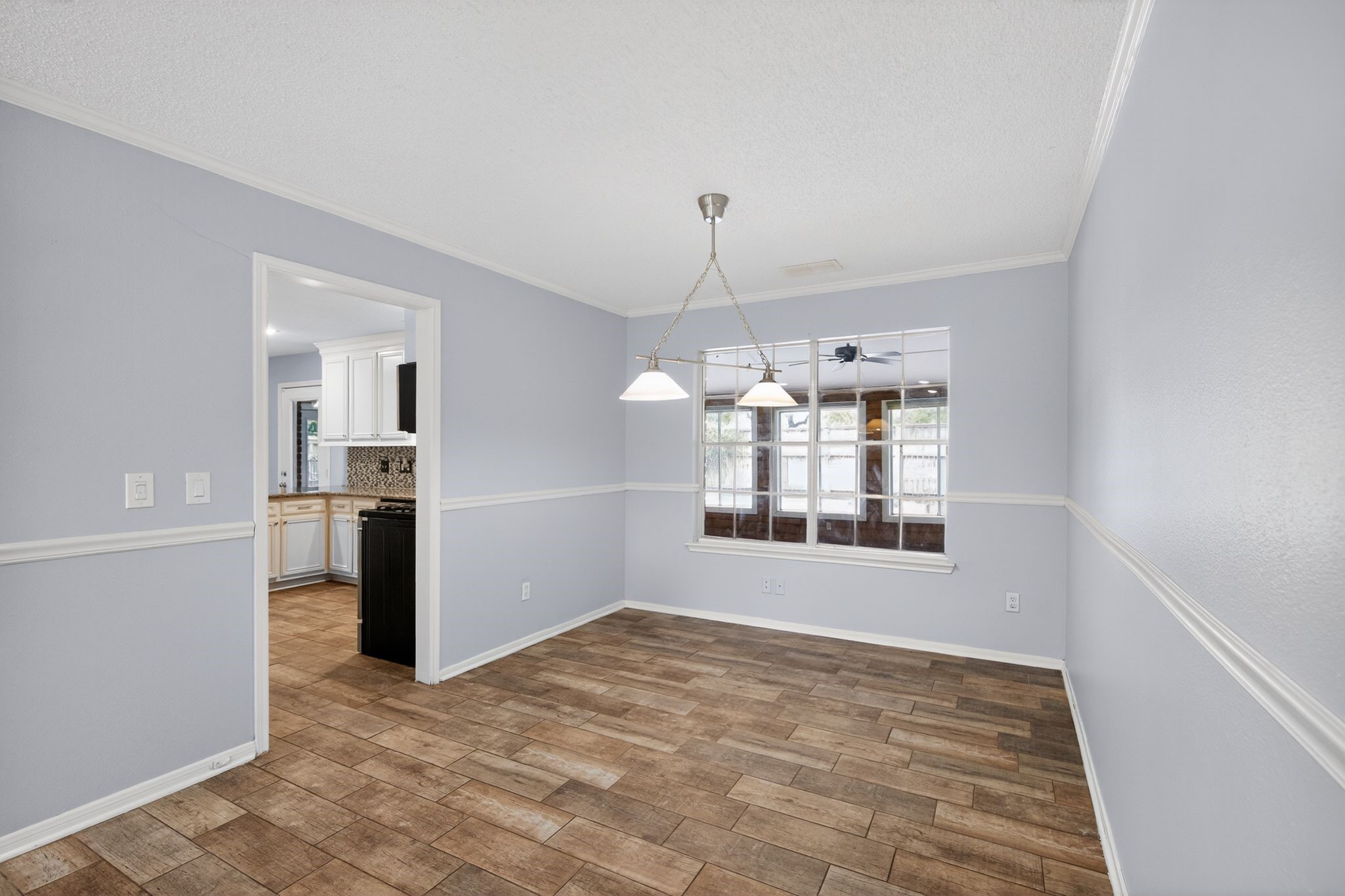 918 Long Prairie Drive Katy, TX 77450 - Photo 20 of 30 a view of a kitchen with a cabinet and a window