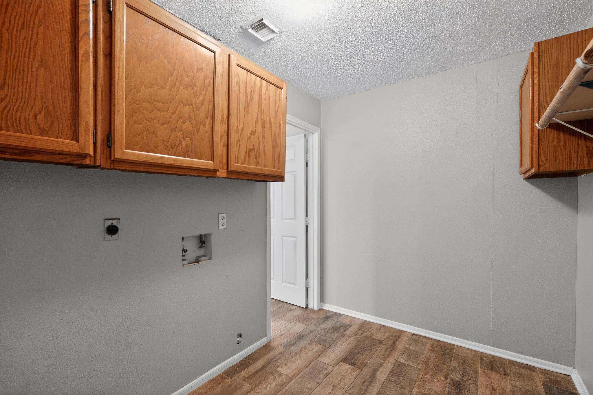 918 Long Prairie Drive Katy, TX 77450 - Photo 28 of 30 a view of storage and utility room with wooden floor