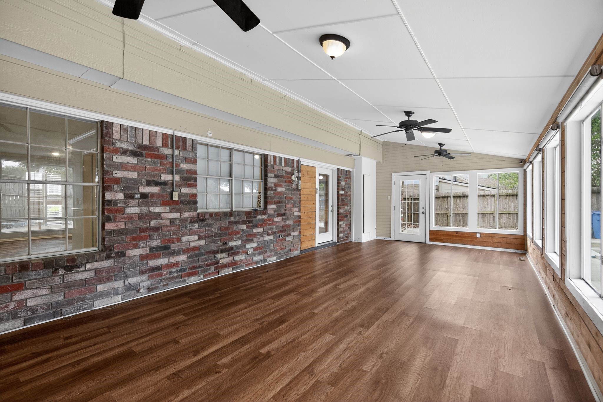 918 Long Prairie Drive Katy, TX 77450 - Photo 29 of 30 a view of an empty room with wooden floor and a window
