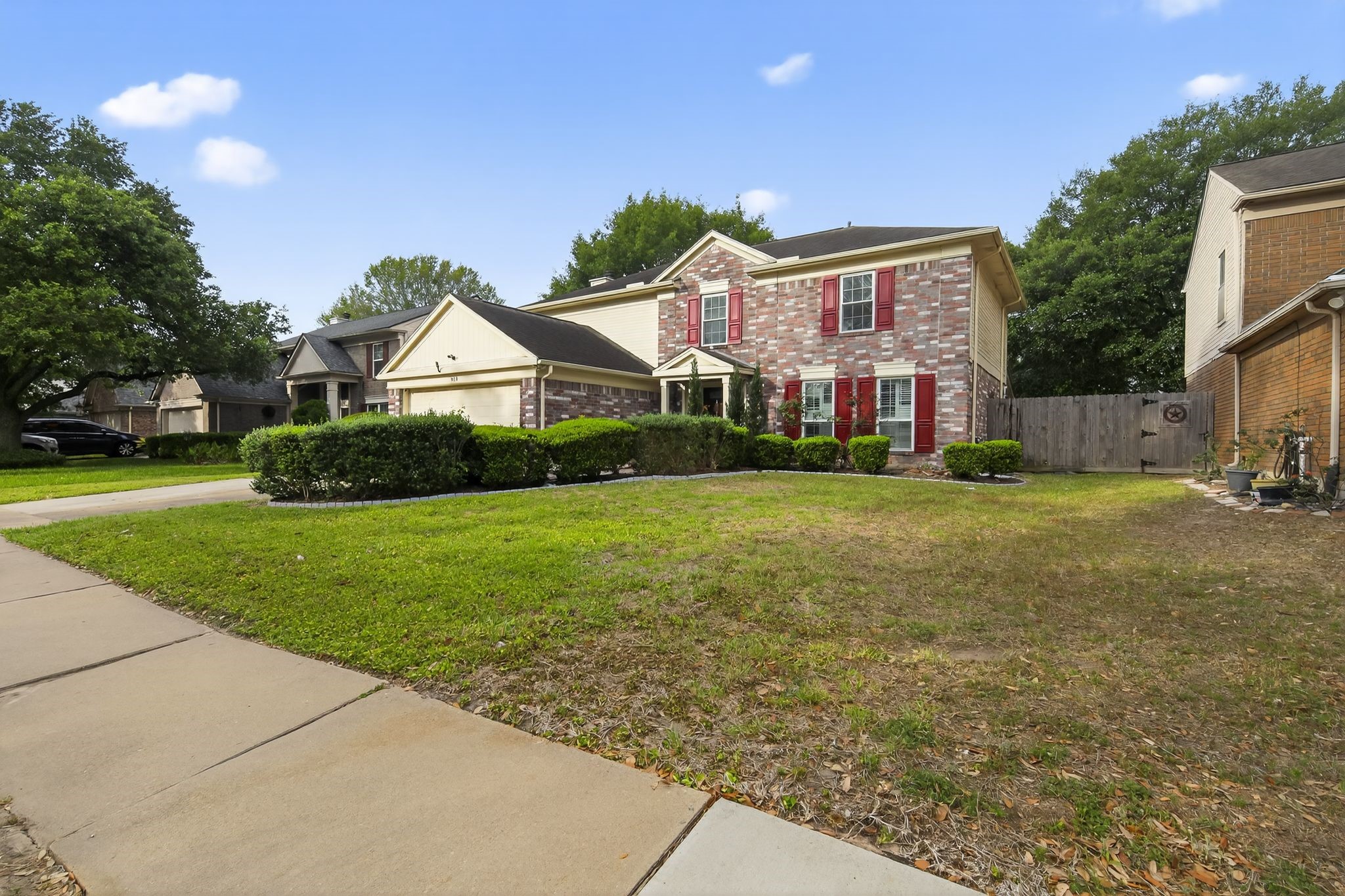 918 Long Prairie Drive Katy, TX 77450 - Photo 5 of 30 a front view of a house with garden