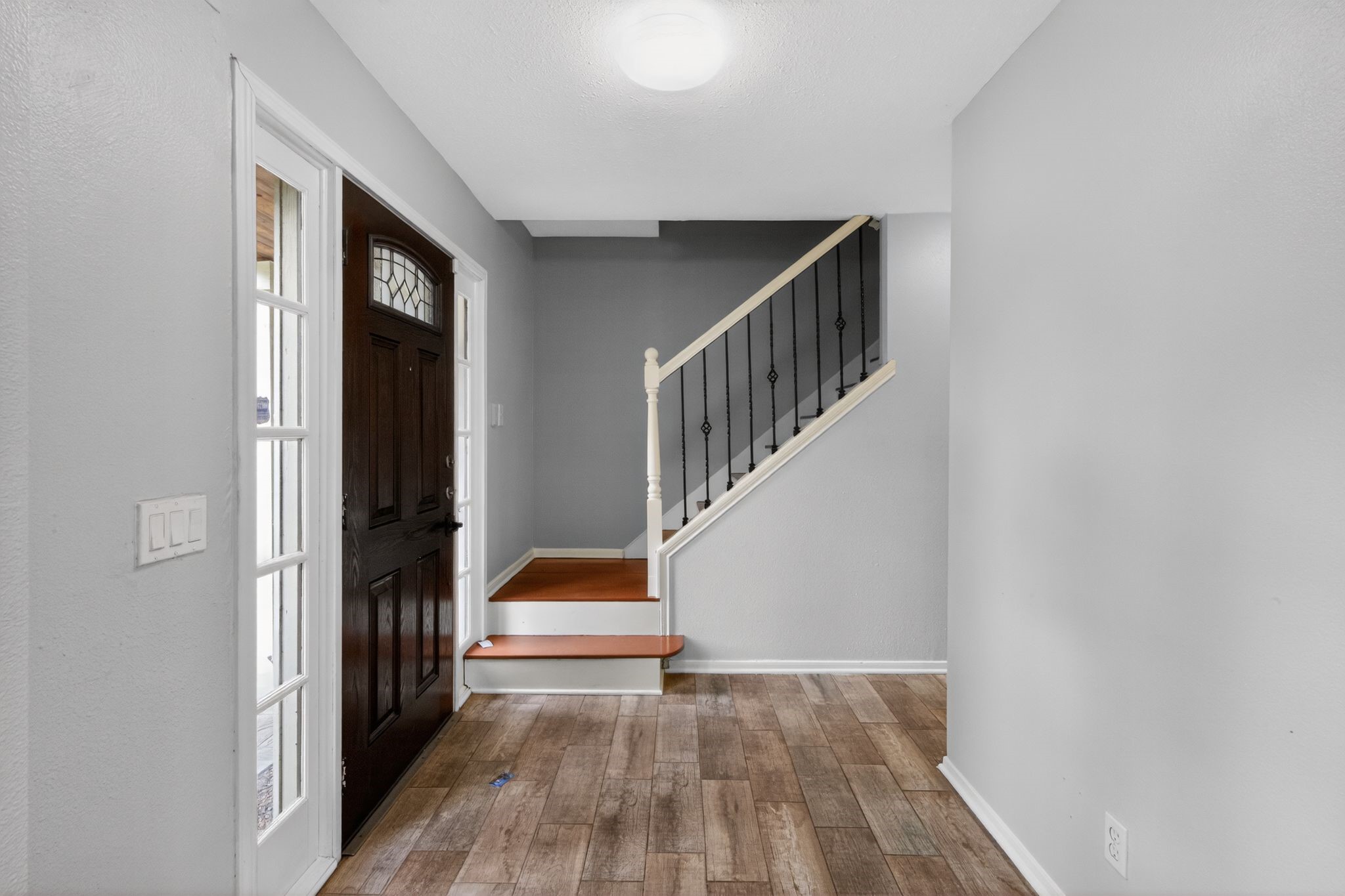 918 Long Prairie Drive Katy, TX 77450 - Photo 9 of 30 a view of entryway and hall with wooden floor