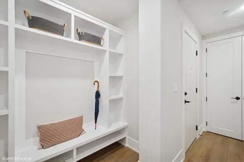 a bedroom with a bed and a night stand