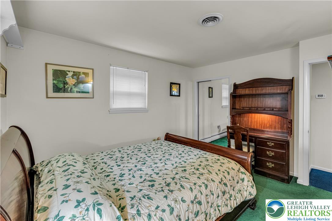 2750 Belaire Road Bethlehem, PA 18017 - Photo 27 of 56 A spacious bedroom features plush carpeting and classic molding details throughout the quiet space.