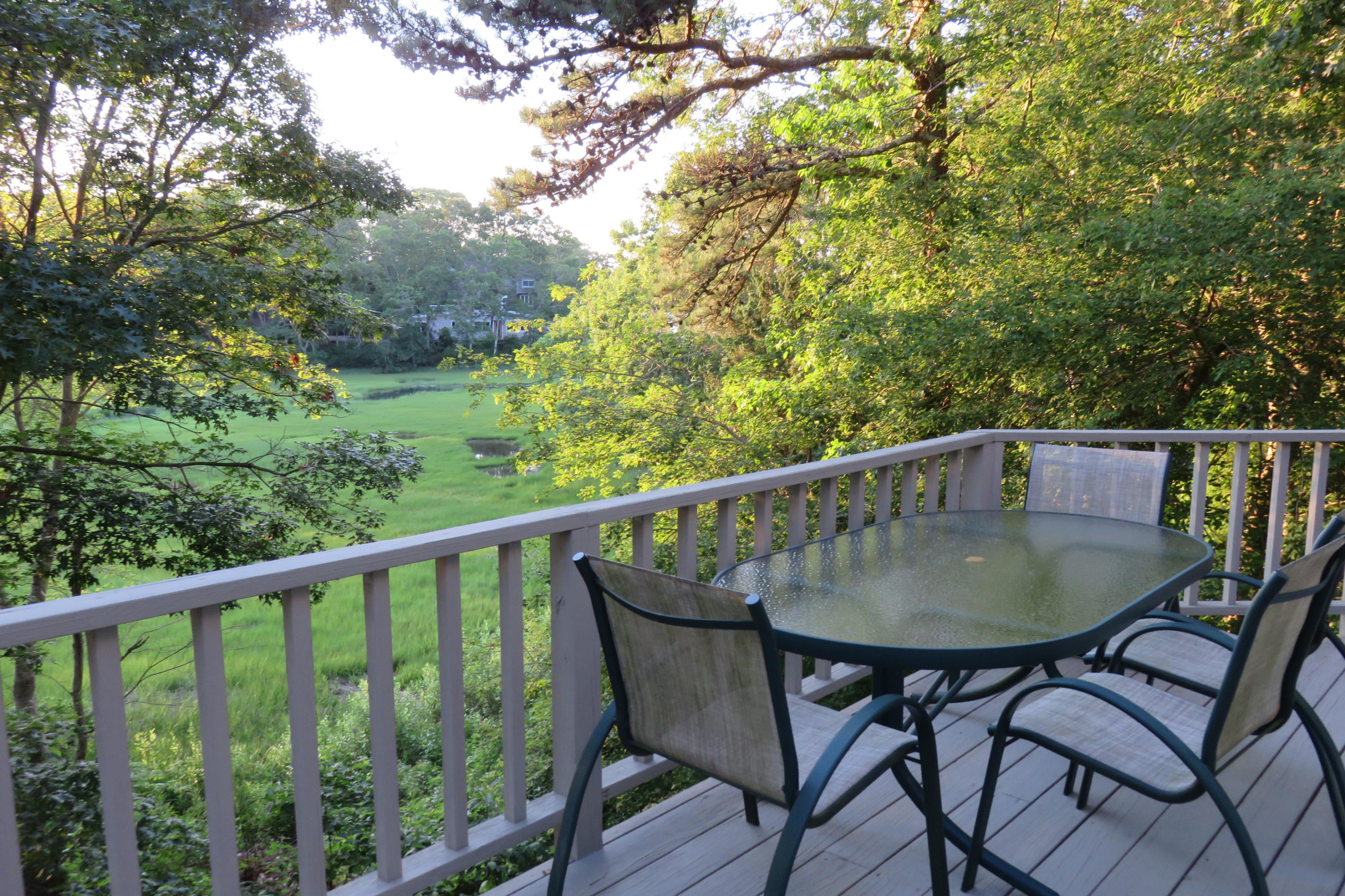62 Summersea Road Mashpee, MA 02649 - Photo 3 of 21 a view of balcony with a table and chairs