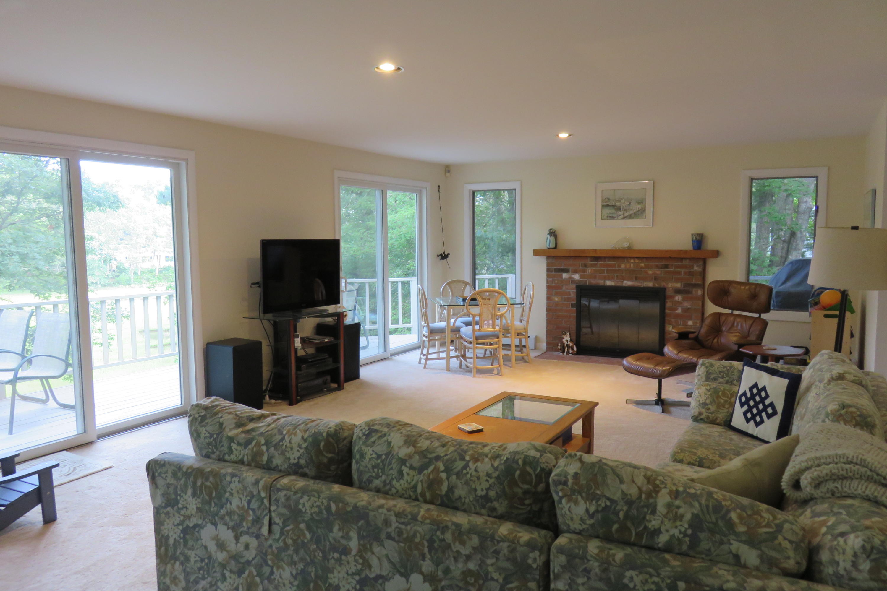 62 Summersea Road Mashpee, MA 02649 - Photo 6 of 21 a living room with furniture a large window and a flat screen tv