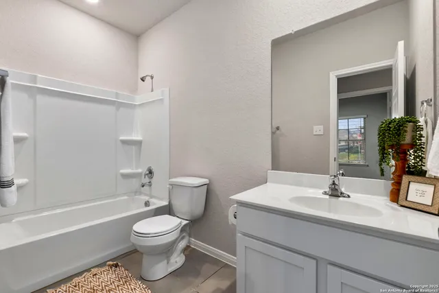 a bathroom with a toilet a sink and a bathtub