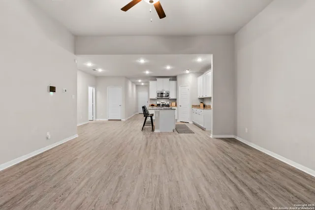 a view of kitchen with furniture and wooden floor