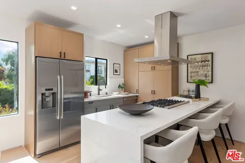 a kitchen with a table and chairs in it